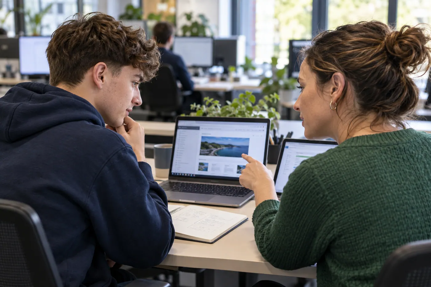 A software apprentice checking an application with an experienced tester.