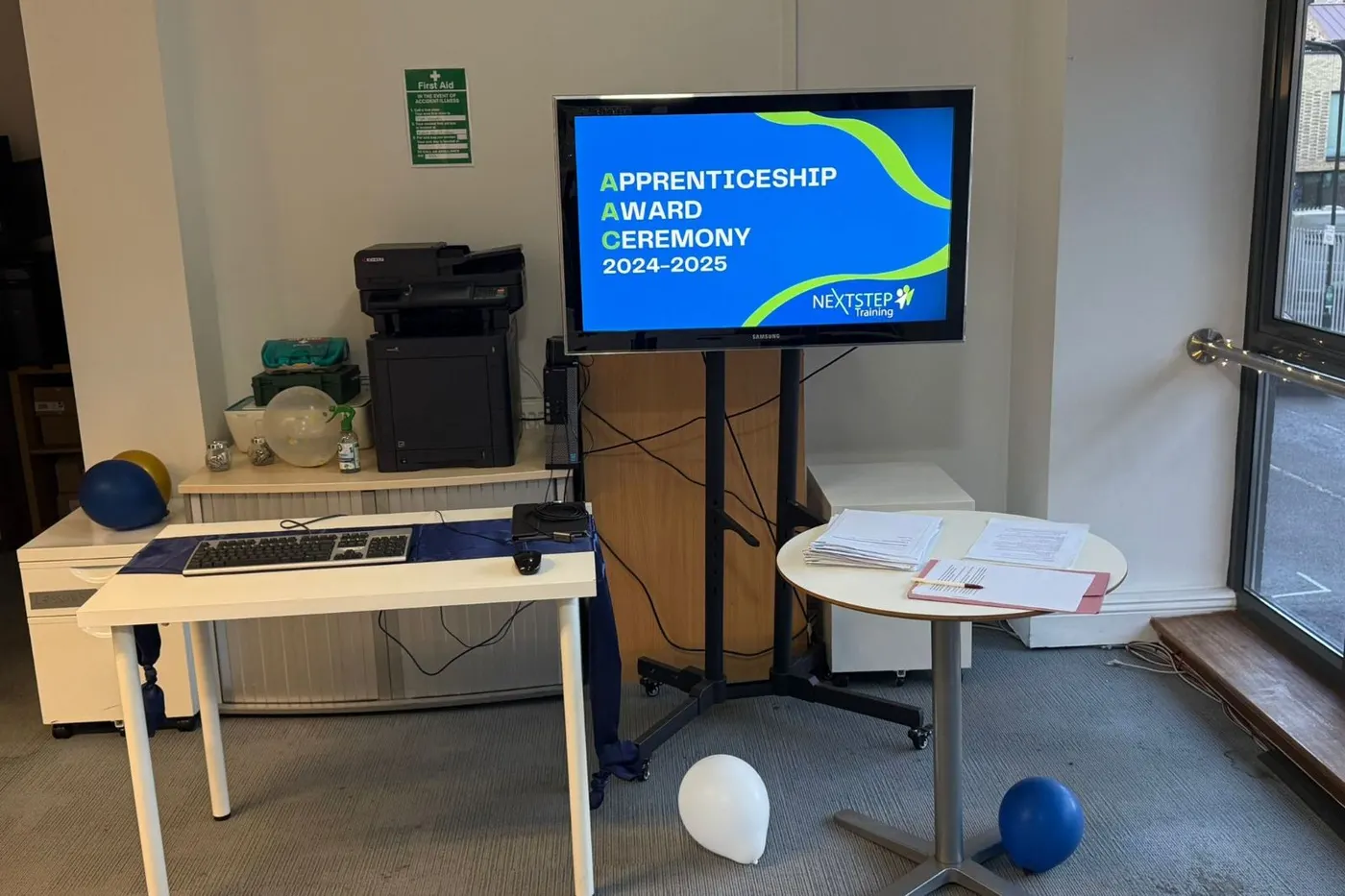 The NextStep office set up for the Apprenticeship Award Ceremony, with the welcome screen on display.